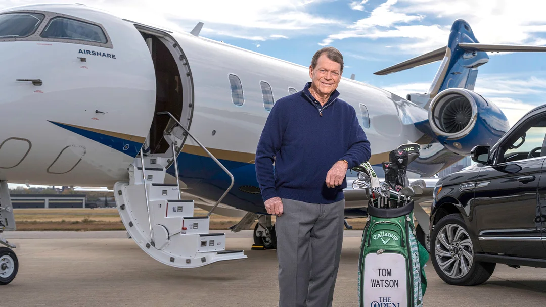 Tom Watson in front of an Airshare jet